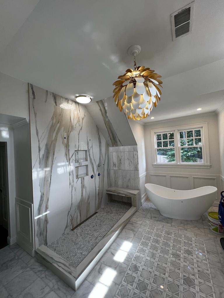 Bathroom marble tile installation in progress